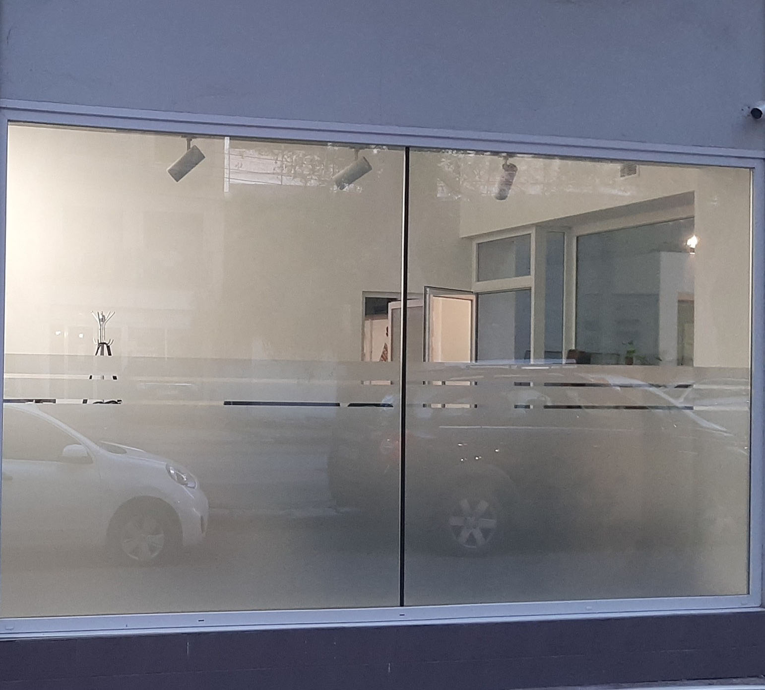 Matte protective window film applied in a modern offices to maximize privacy
